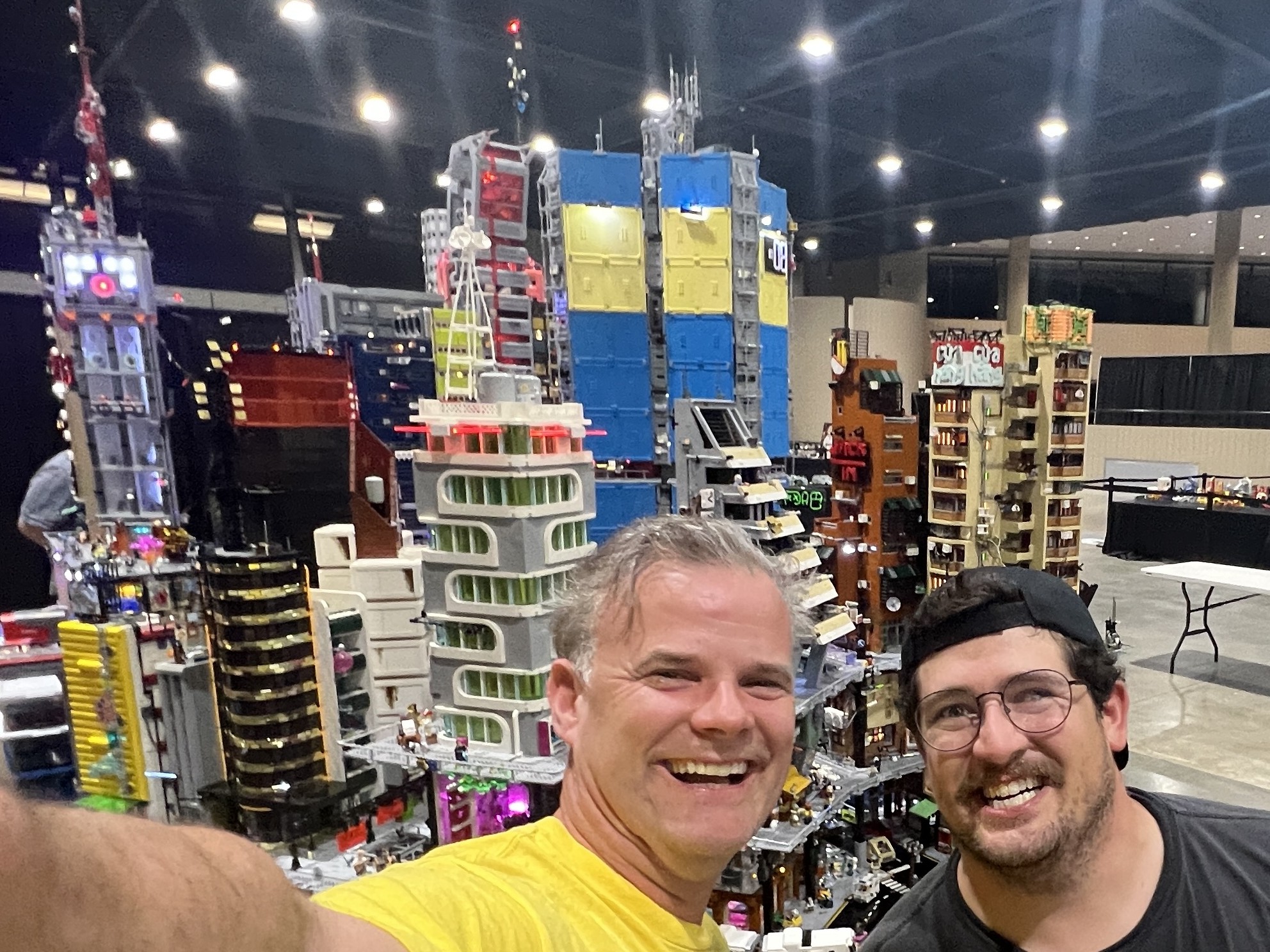 Two members selfie infront of a LEGO® city