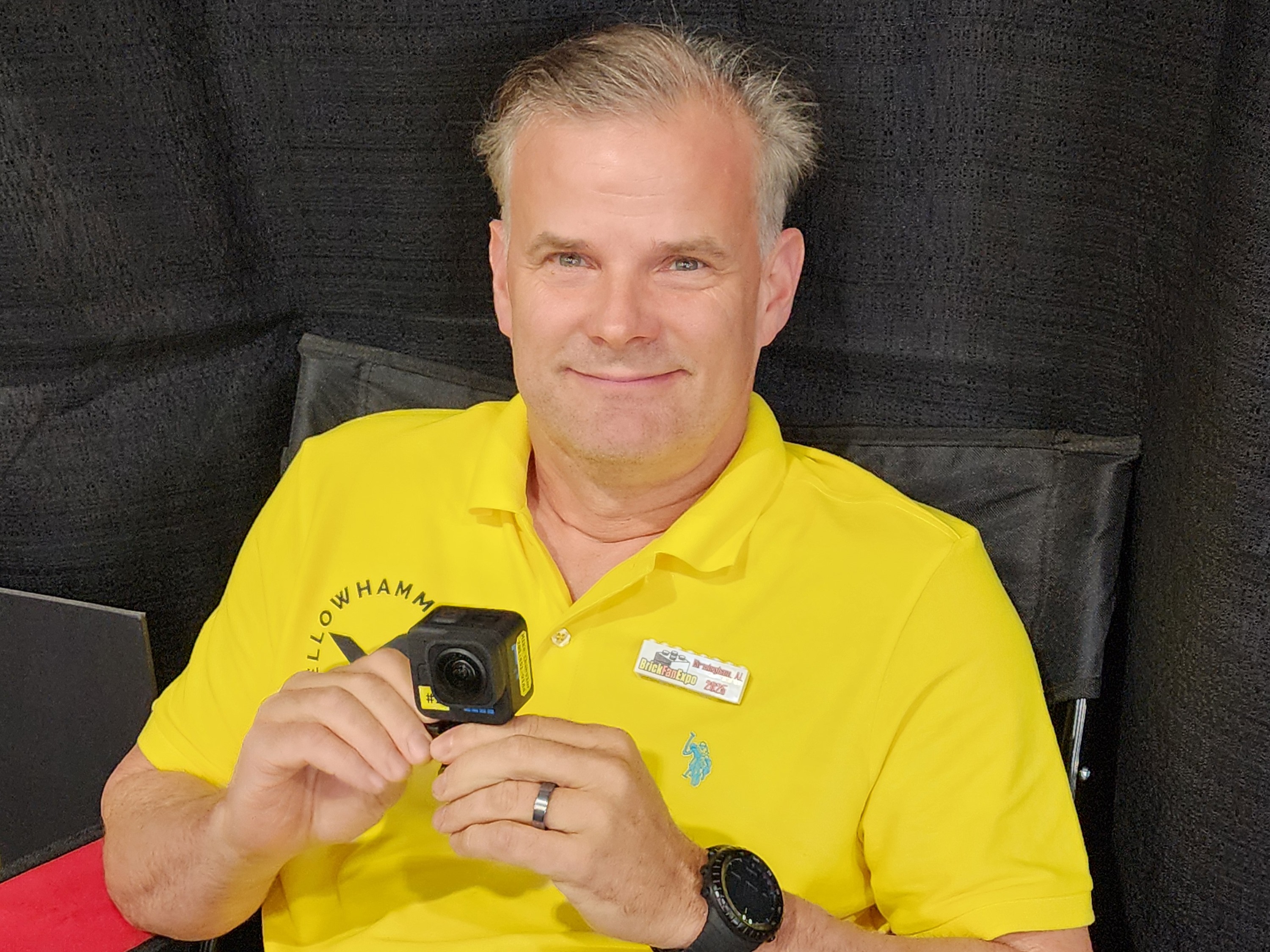 Member holding a camera